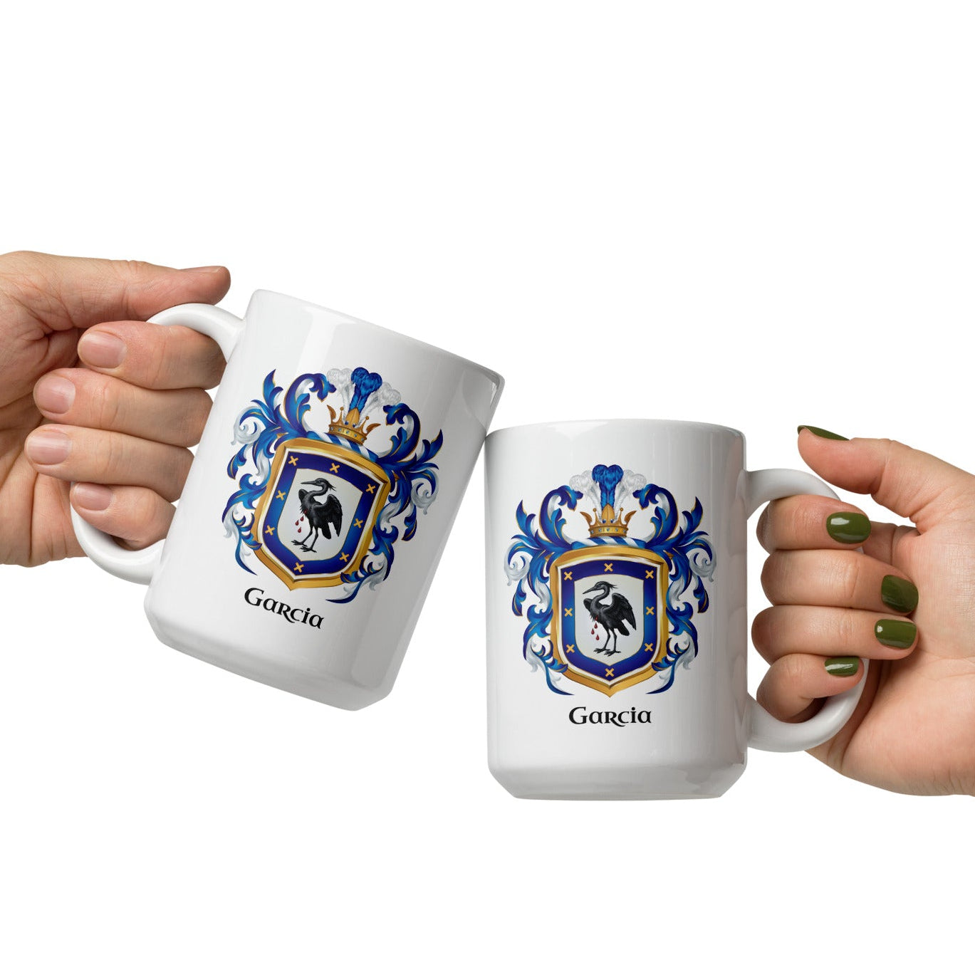 Two hands holding white mugs with Garcia family crest designs on a white background in a 'cheers' gesture with the mugs touching