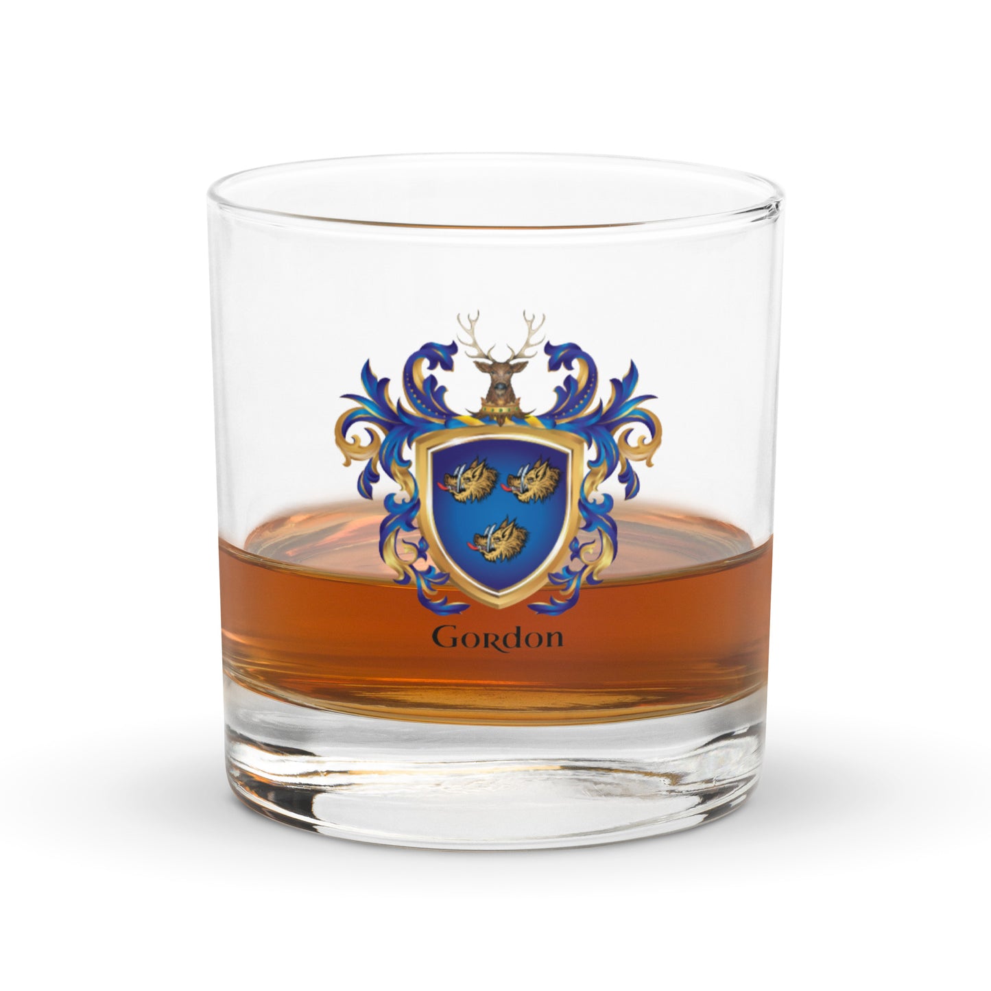A clear rocks glass containing whisky, printed with a blue, gold, and white heraldic crest and the name Gordon below it, shown on a clean white background.