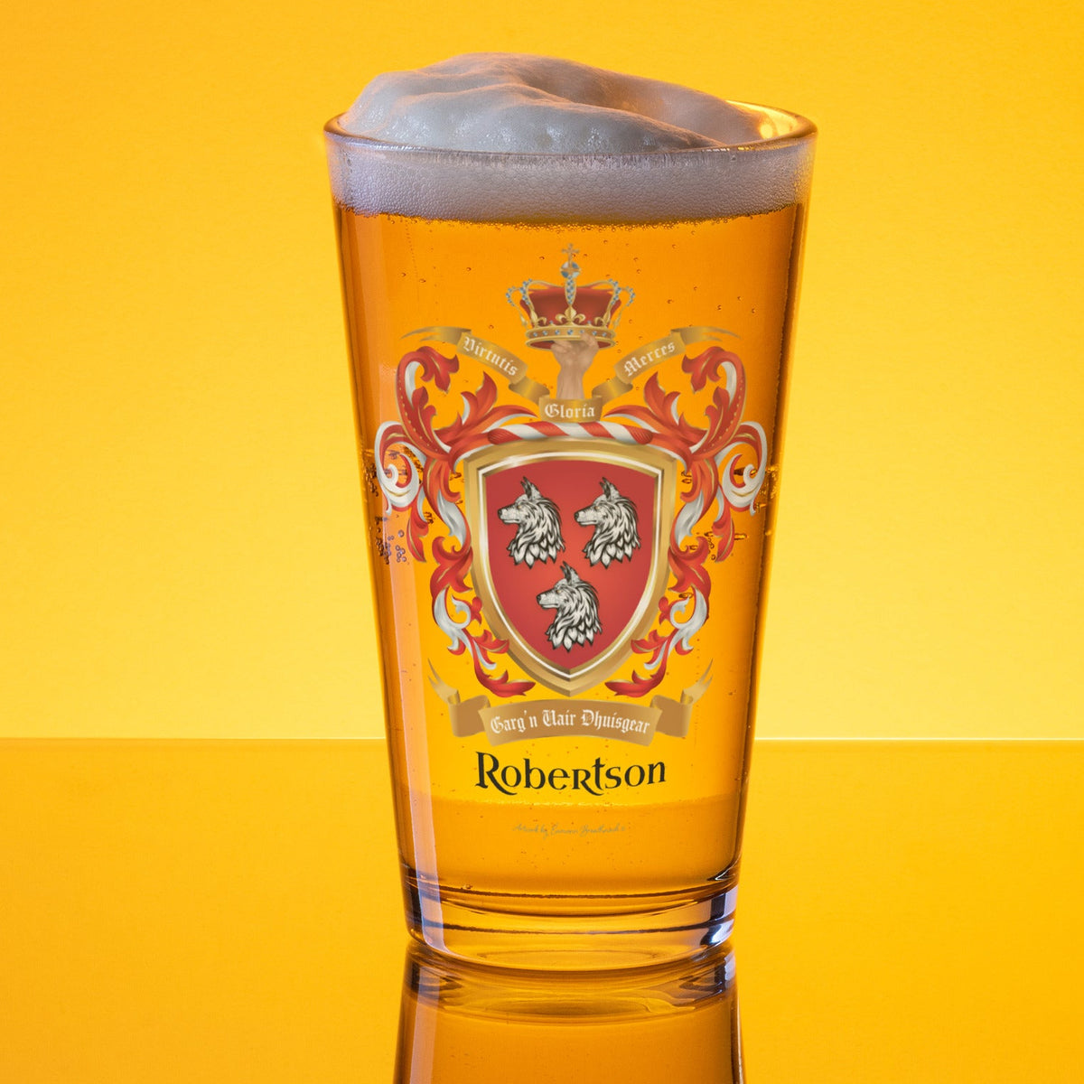 Pint glass with a Robertson Family Crest design and 'Robertson' text on a yellow background