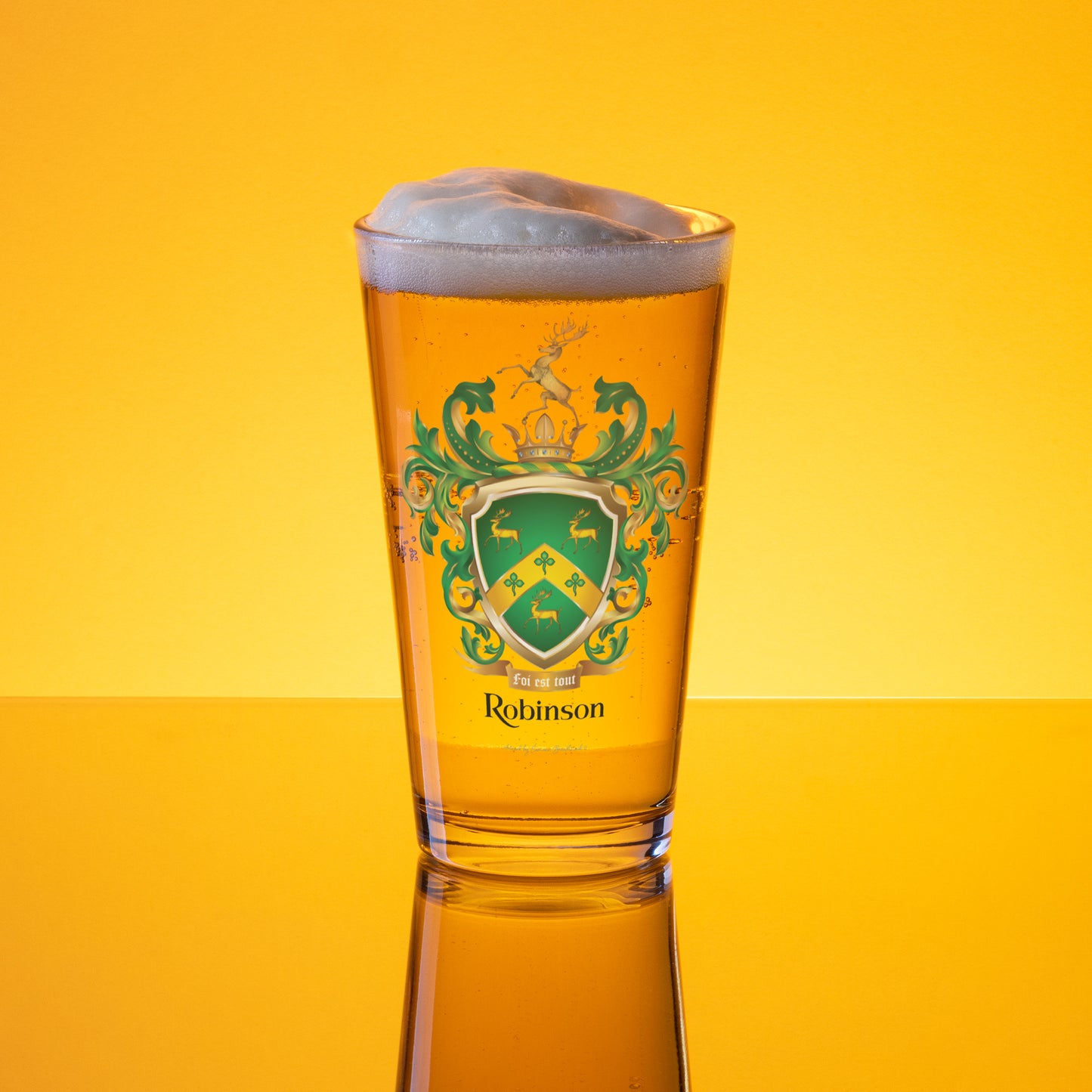Pint glass of beer with a Robinson Family Crest on a yellow background