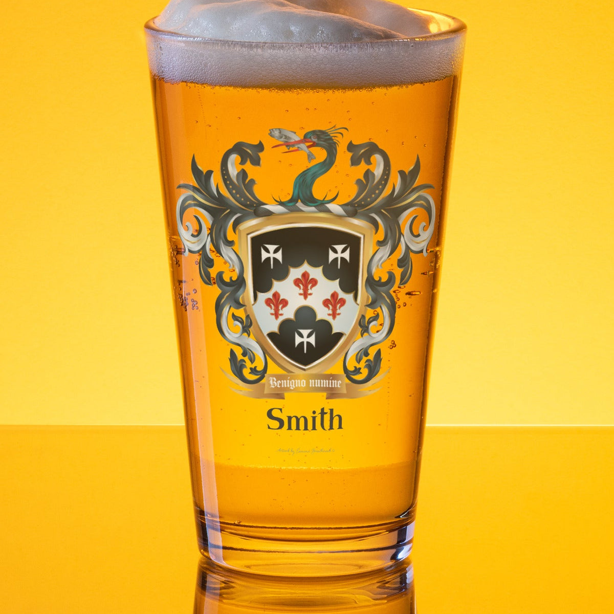 Pint glass with a Smith family crest design on a pint of golden beer