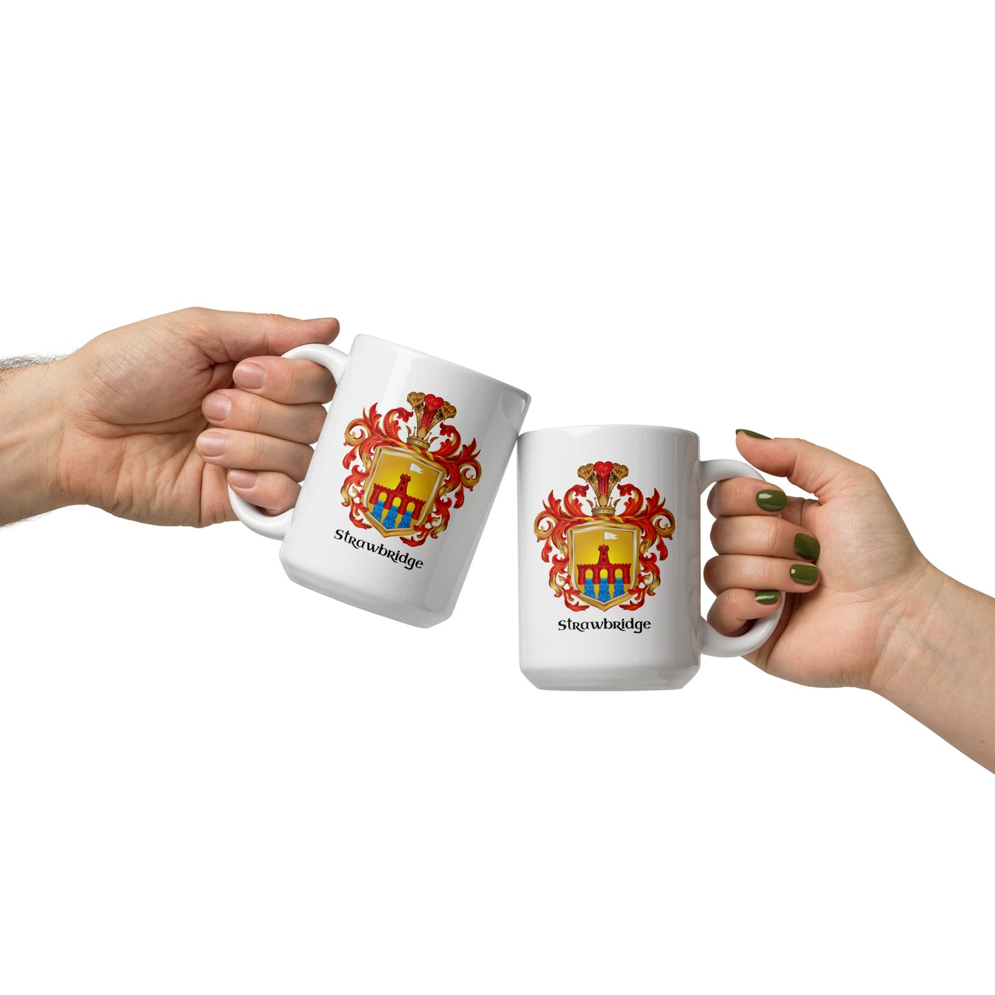 Two white ceramic mugs with the same heraldic coat of arms and the word 'Strawbridge Family Crest' printed below, held by two hands against a plain white background.