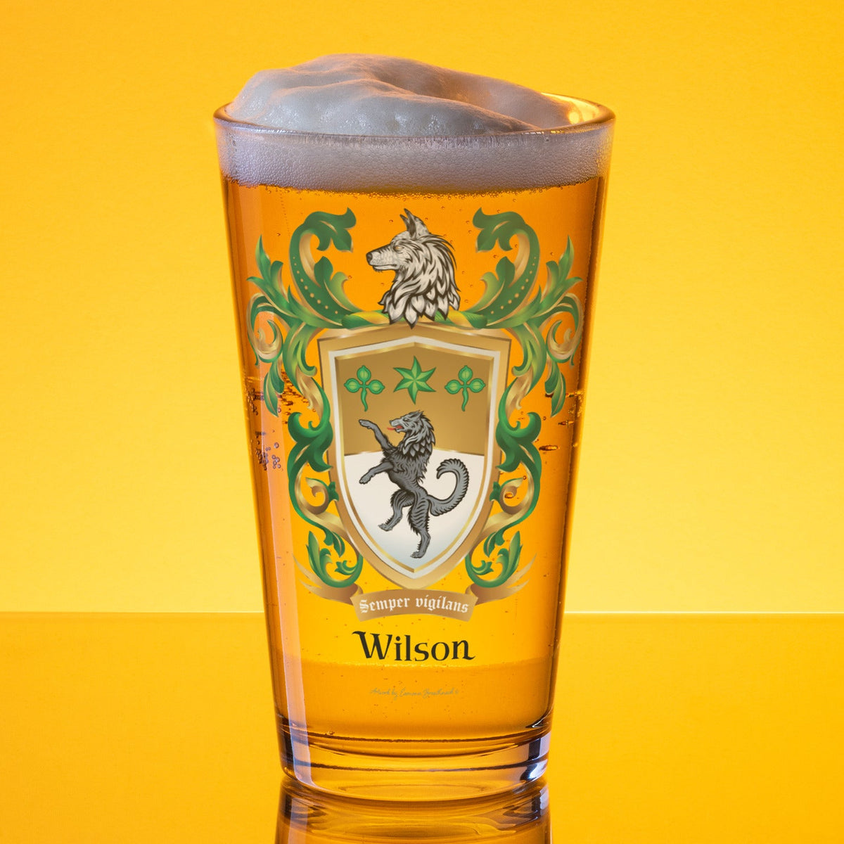 Glass of beer with a Wilson family crest eith a standing wolf on a gold and white shield
