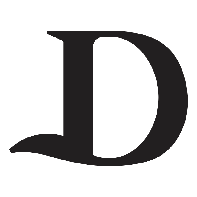 A close up detail of family crest typography showing stylised typographic bold black letter D on a plain white background.