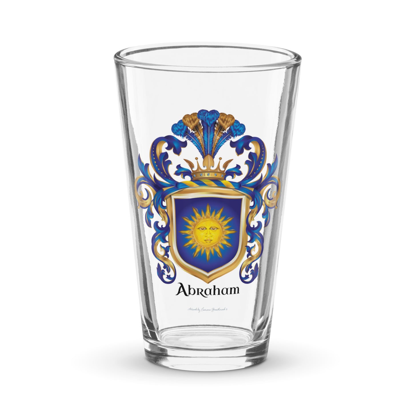 A pint beer glass with the Abraham Family Crest featuring a blue shield with a sun facemotif known as the "sun in splendour" 