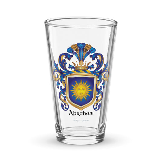 A pint beer glass with the Abraham Family Crest featuring a blue shield with a sun facemotif known as the "sun in splendour" 