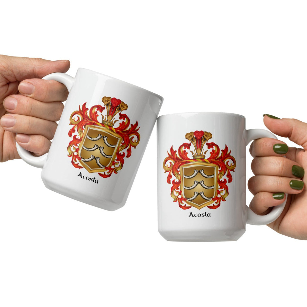 Two hands holding white ceramic mugs with a matching family crest design and the name 'Acosta' printed below, set against a plain white background.