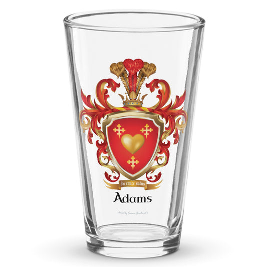A classi pint glass with the Adams Family Crest featuring a gold heart and 3 crosslets on a red shield