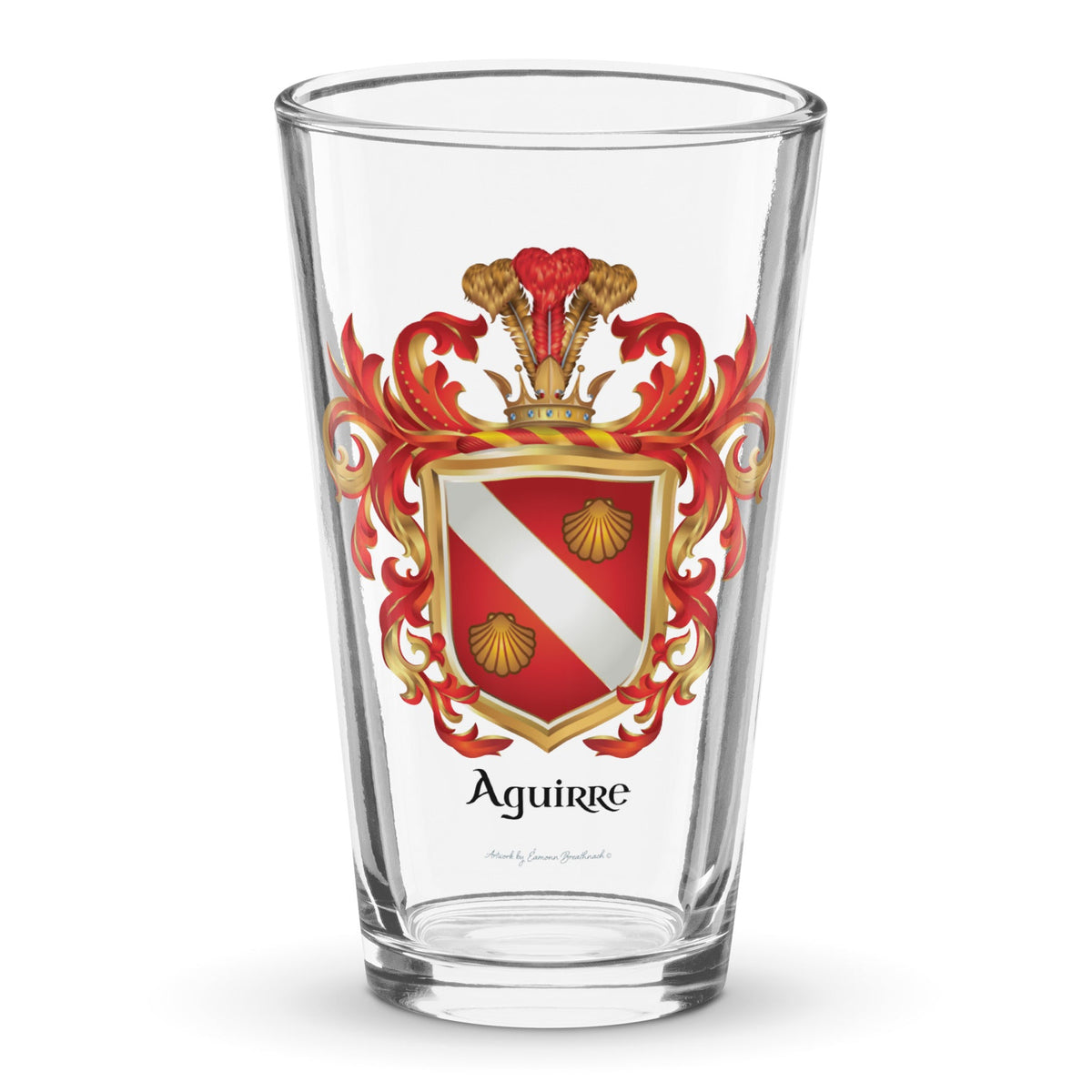 The Aguirre Family Crest on a pint beer glass featuring a red shield with a white band and 2 gold clam shells - Family Crests Store