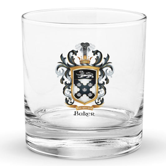 A classic rocks glass with the Baker Family Crest printed on it featuring 5 shells, and a white lion.