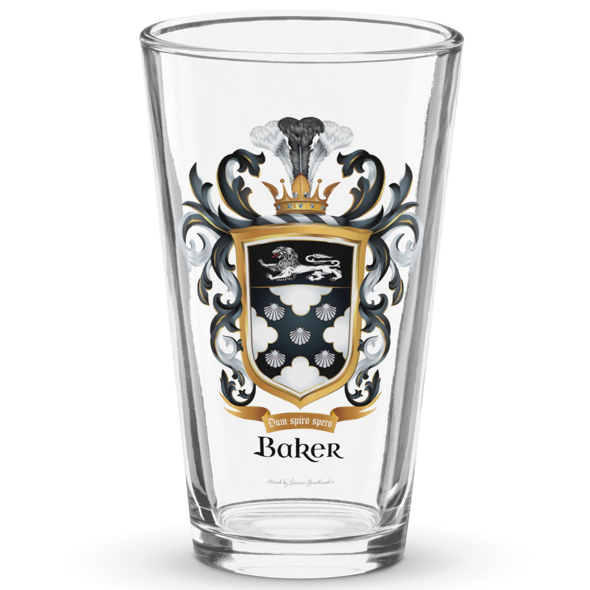 A pint beer glass with the Baker Family Crest printed on it featuring 5 shells, and a white lion.