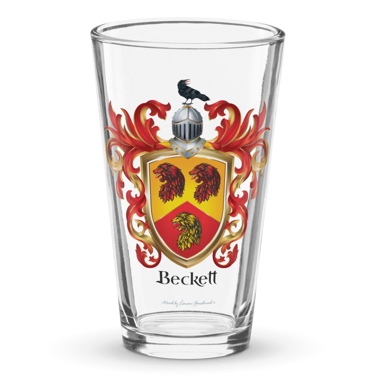 A classic clear pint beer glass with Beckett Family Crest showing 3 lion heads and a raven on a helmet