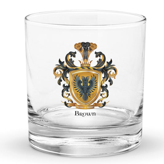 An illustration of the Brown Family Crest featuring a two-headed eagle printed on a clear rocks glass on a white background