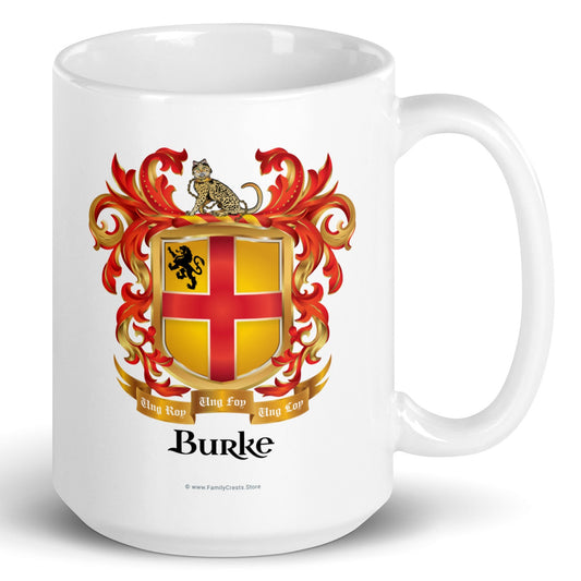 A white mug with handle to right, on a white background, printed with the Burke Family Crest featuring a gold shield with a red cross.