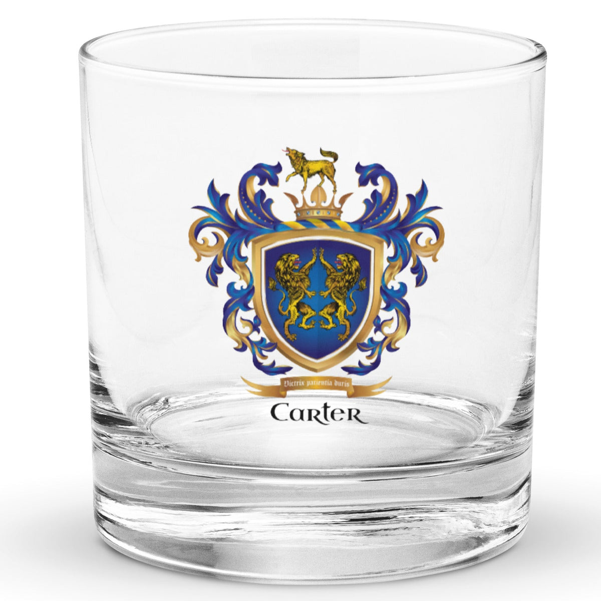 A clear classic heavy base rocks glass on a white background, printed with the Carter Family Crest featuring 2 lions on a blue shield and a wolf on a crown on the crest above the shield.