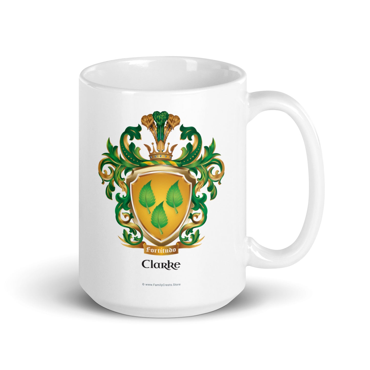 White mug with a green and gold Clarke Family Crest design on a white background