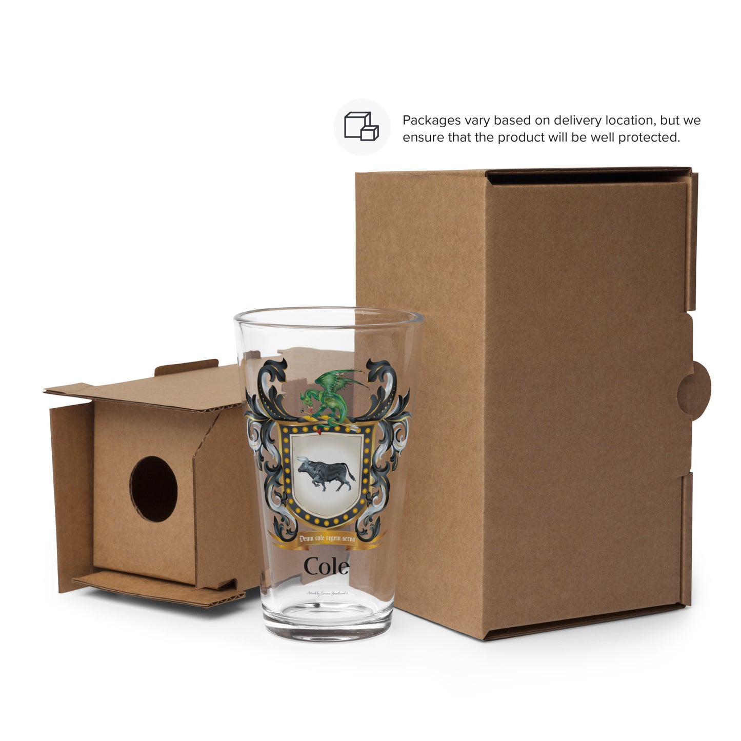 Cole family coat of arms showing a black bull and a dragon on the front of a glass beside a cardboard packaging box