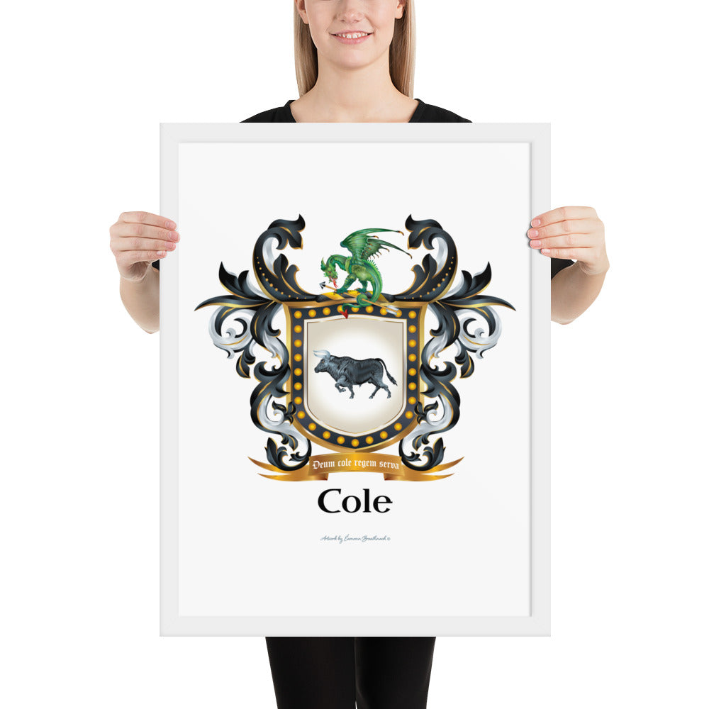 A woman holdinf a framed print of the Cole family  crest featuring a black bull on a white shield and a dregon with an arow on the crest of the shield.