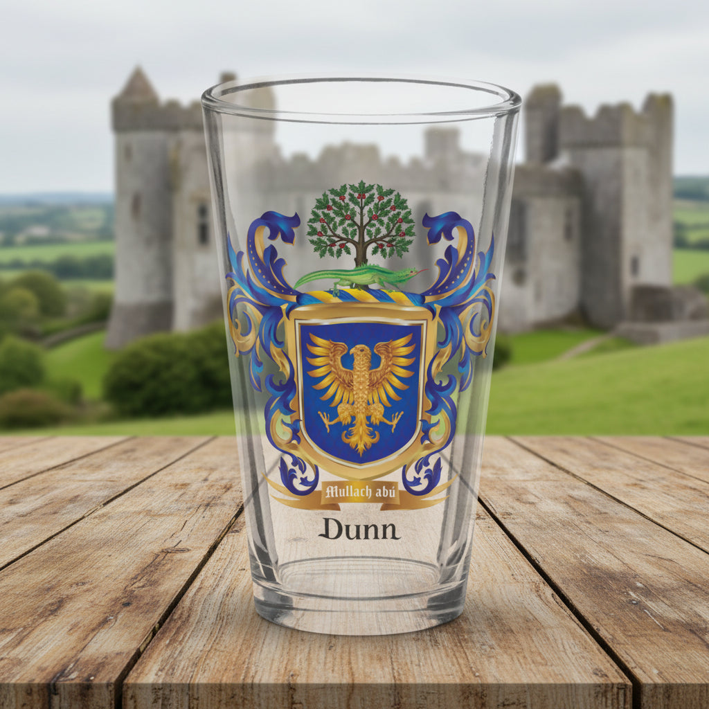 Dunn family crest on a pint glass with a castle in the backgroug