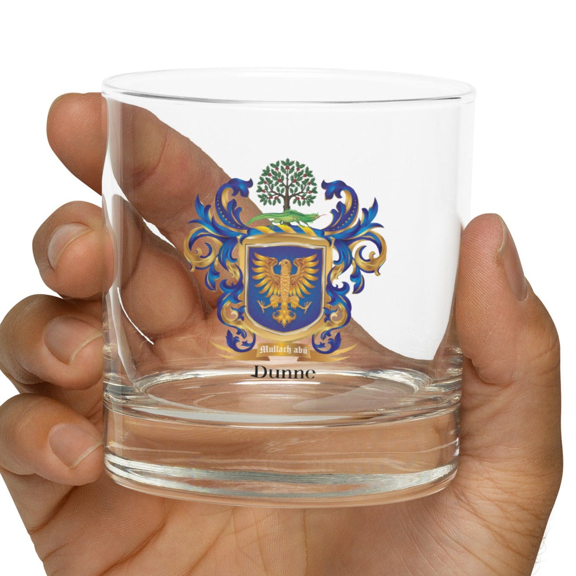 Clear glass with 'Breezy Brand' text held in a hand on a white background