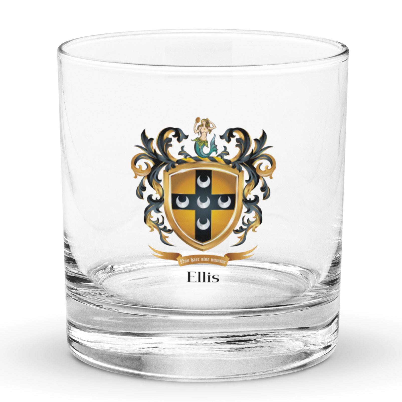 A rocks glass on a white background with the Ellis Family Crest featuring five silver crescents on a black cross on a old shield with a mermaid on the crest above the shield.