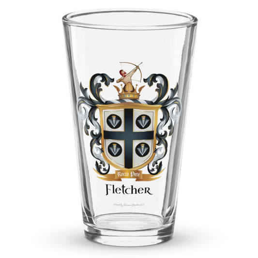 A clear classic pint beer glass on a white background, printed with the Fletcher Family Crest featuring an archer and 4 arrow heads.