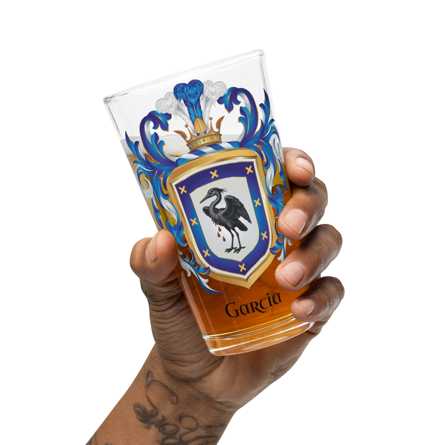 Hand holding a glass with a Garcia Family-Crest coat of arms with heron on a white background