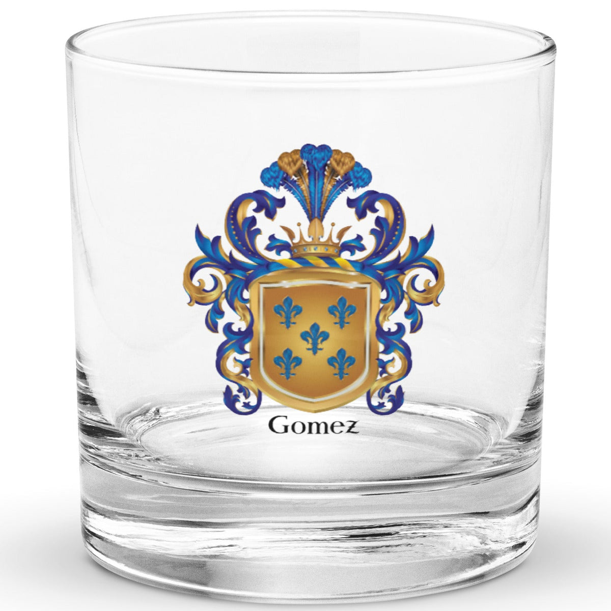 A clear classic heavy base rocks glass on a white background, printed with the Gomez Family Crest featuring 5 blue fleur-de-lis on a gold shield.
