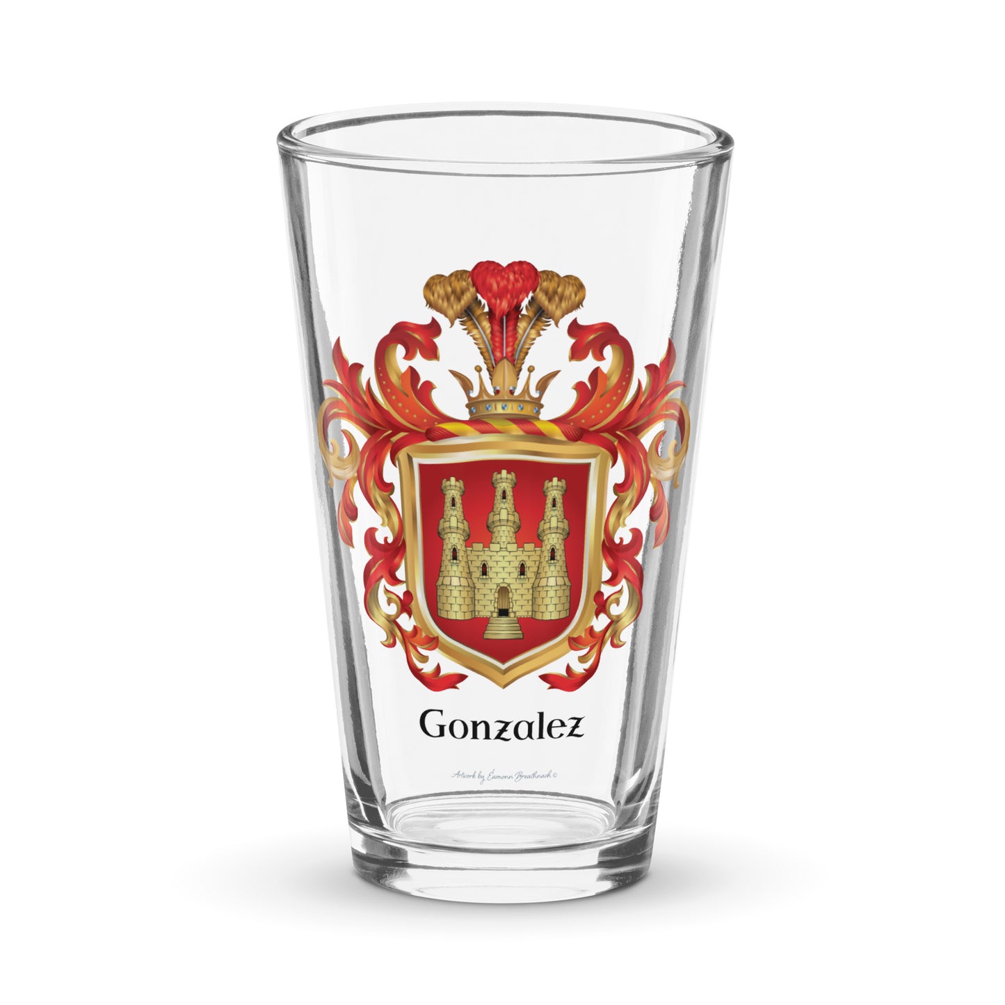 A clear pint glass with the Gonzalez Family Crest featuring a golden castle with 3 towers on a red shield pictured on a white backgroud