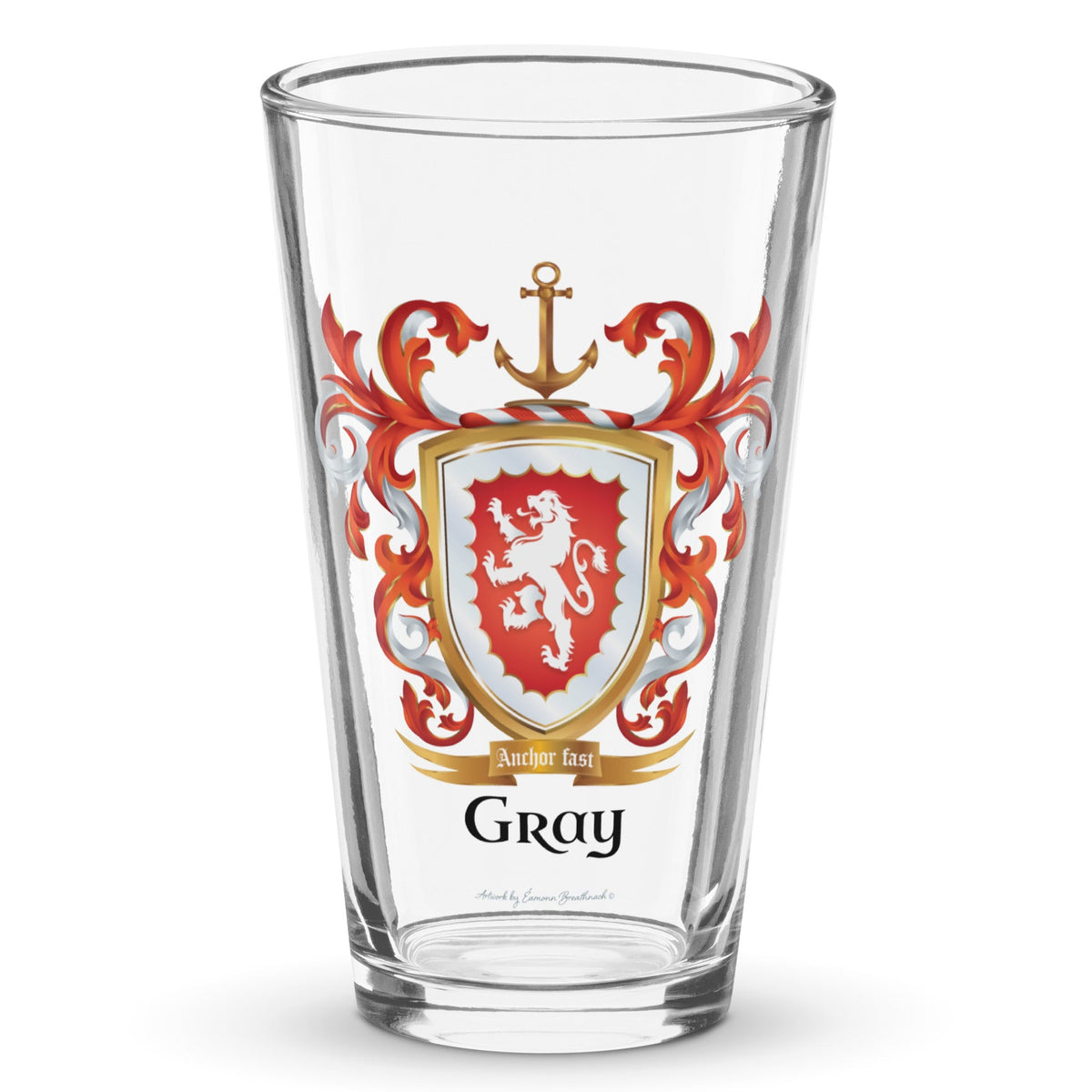 A clear classic pint beer glass on a white background, printed with the Gray Family Crest featuring a red shield and white lion and a gold anchor on the crest.