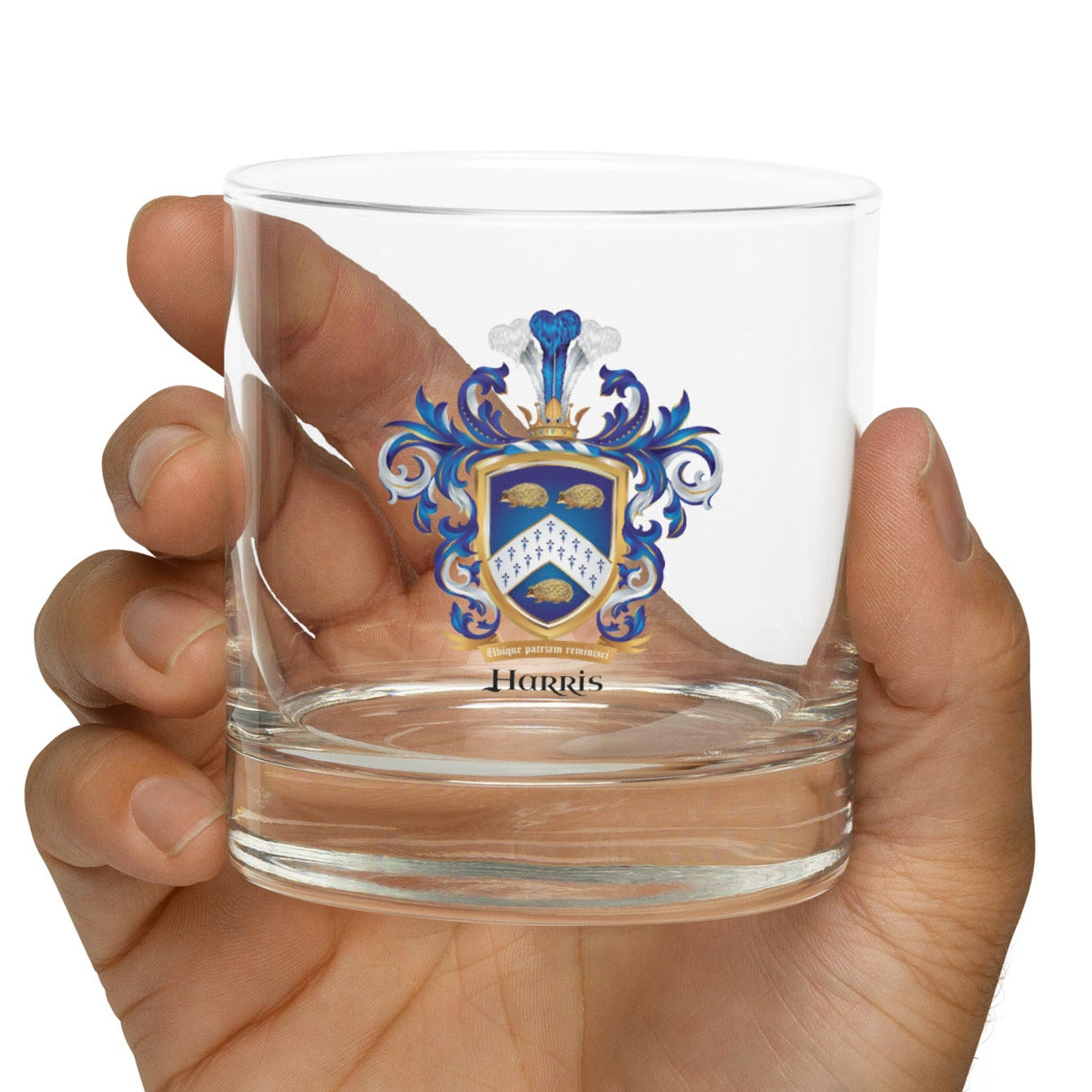A hand holding a Harris-Family-Crests-rocks-glass