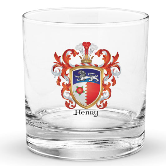 A rocks glass on a white background with the Henry Family Crest featuring a white lion and a red rose on a blue white and red shield with red and white mantling.