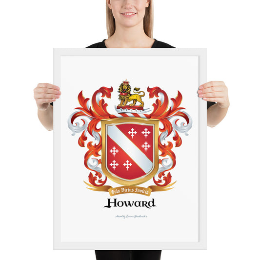 A woman standing in a white background, holding a white framed print of the Howard Family Crest which has a red shield with a white diagonal band and 6 white crosses.