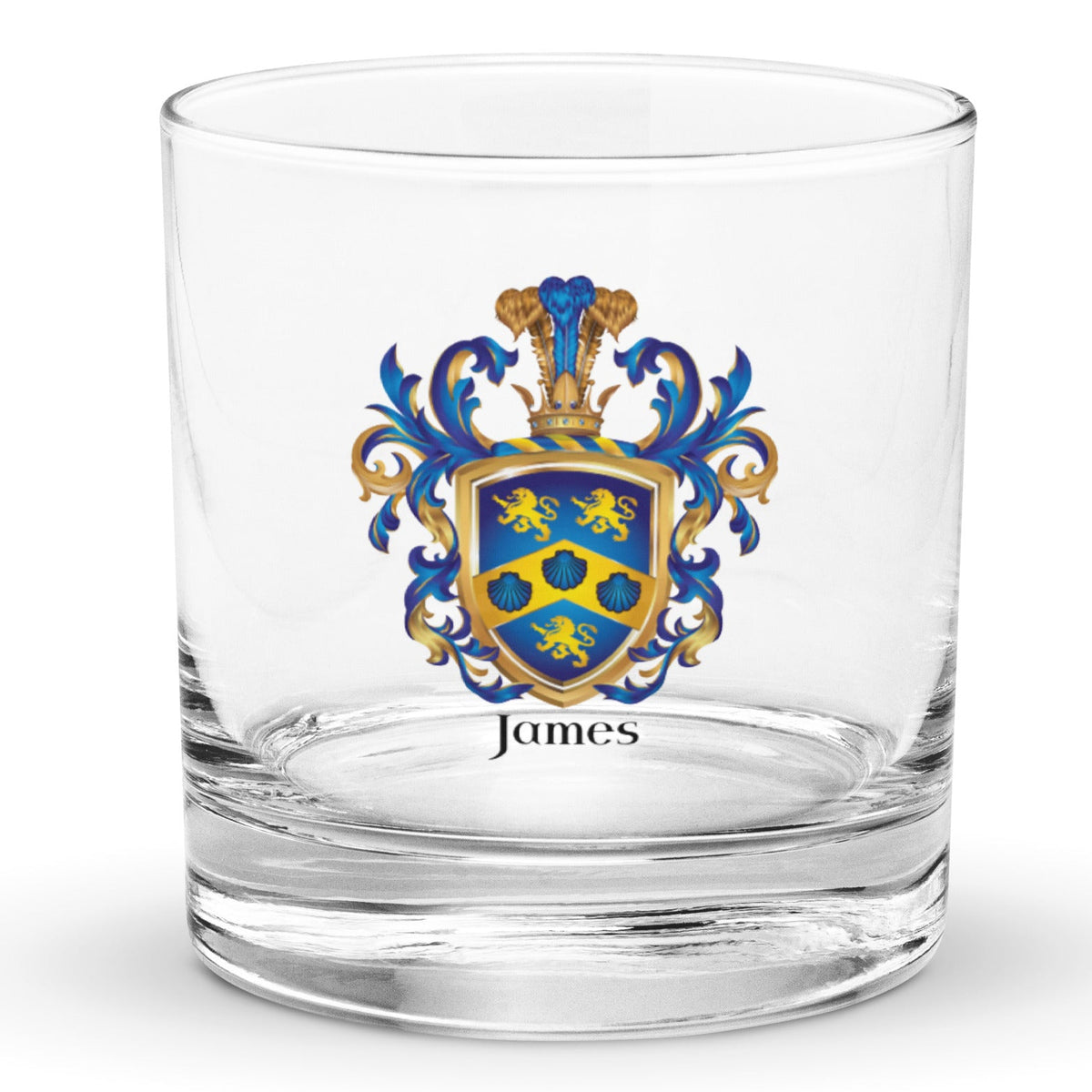 A clear classic heavy base rocks glass on a white background, printed with the James Family Crest which features a blue shield with a golden chevron containing 3 blue clam shells and two gold lions above the chevron and one beneath it.
