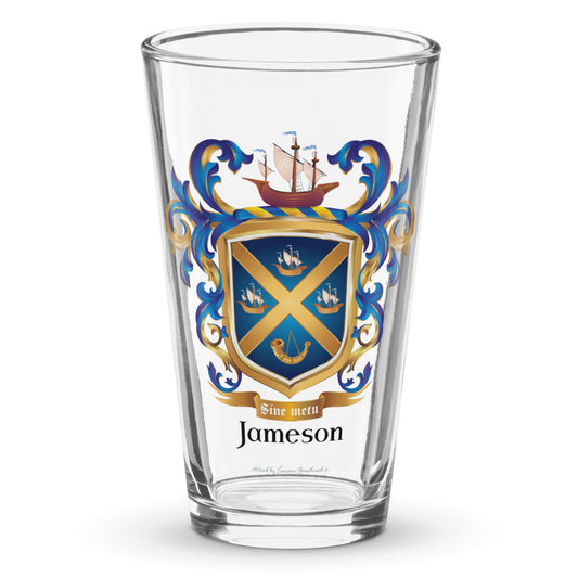 A clear classic pint beer glass on a white background, printed with the Jameson Family Crest featuring a blue shield with a gols diagonal cross, 3 ships and a horn.