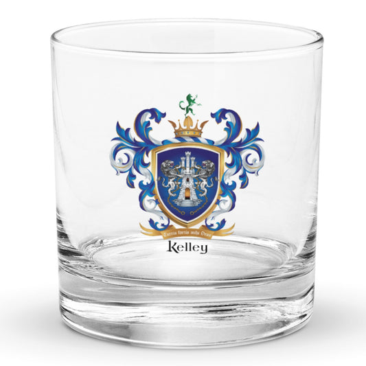 A clear rocks glass with heavy base on a white backgroun with the Kelley Family Crest printed on it