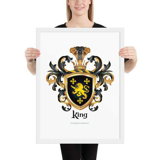 A woman holding a white framed print of the King Family Crest featuring 3 GOLD CROSSES AND A GOLD LION ON A BLACK SHIELD.