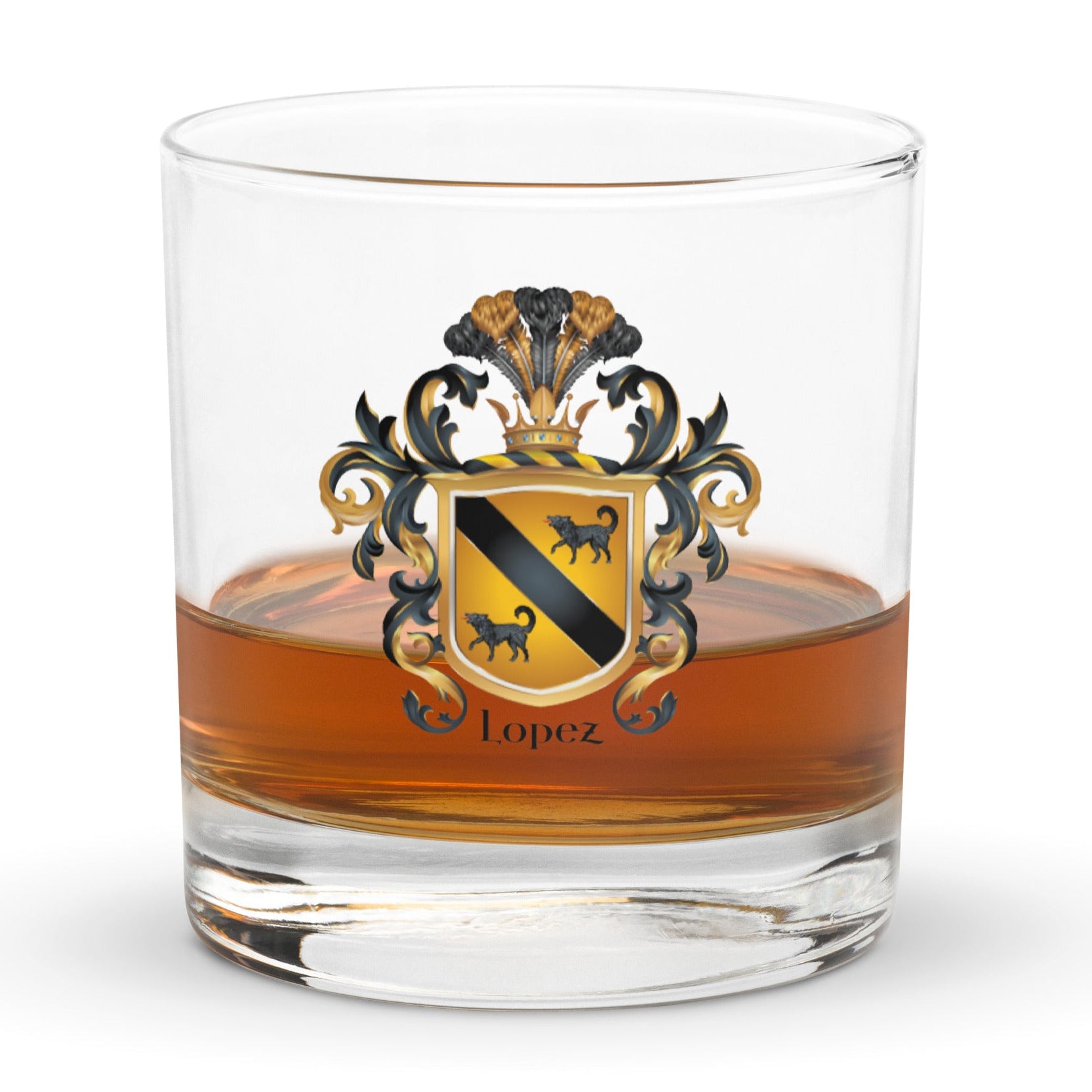 A rocks glass with whiskey with the Lopez Family Crest printed on the front of the glass featuring a gold shield with a black diagonal band and two black wolves and the name Lopez in black text below the shield.