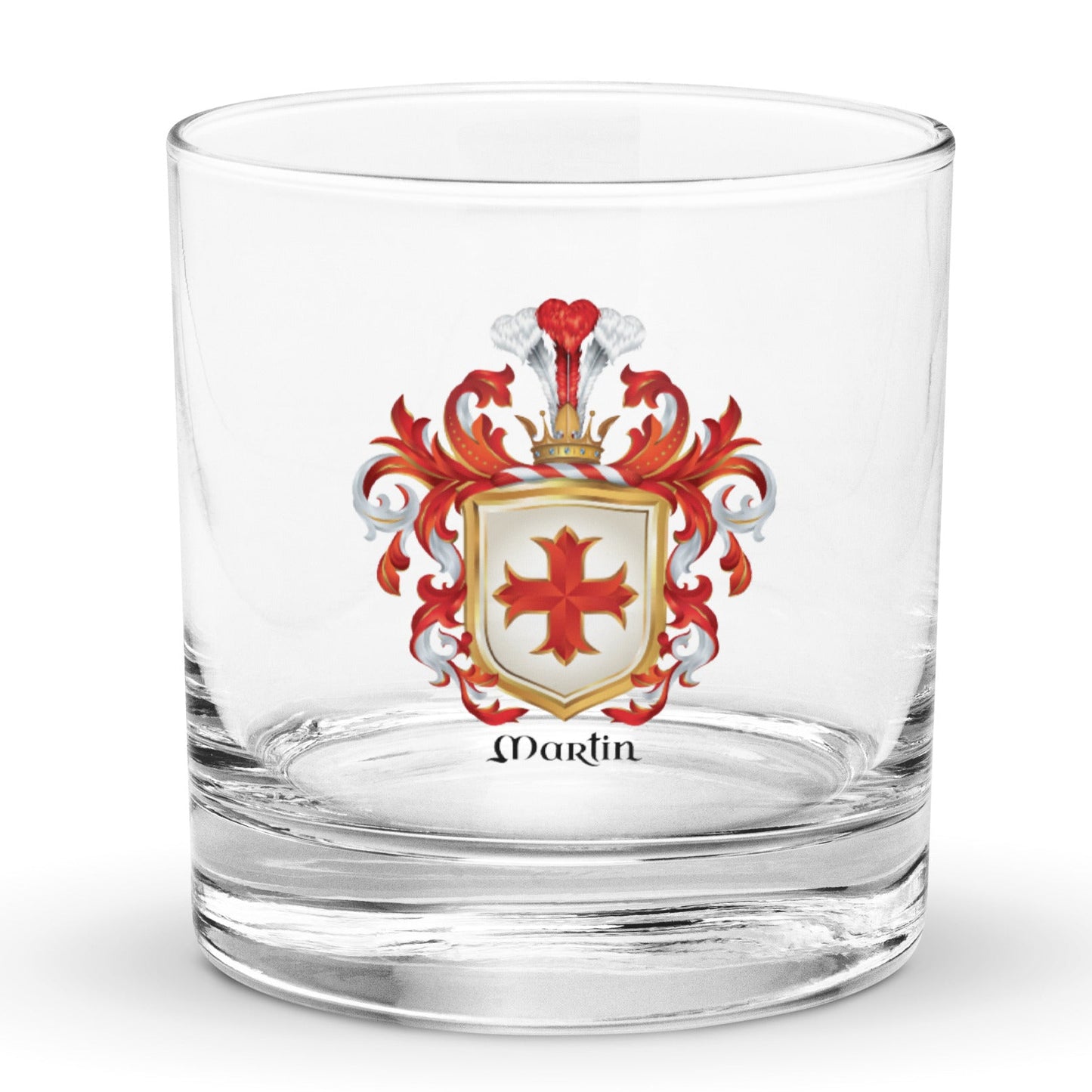 A clear glass rocks tumbler with a printed Martin Family Crest family crest featuring a red cross on a white shield, red and silver mantling, and the name 'Martin' printed below.