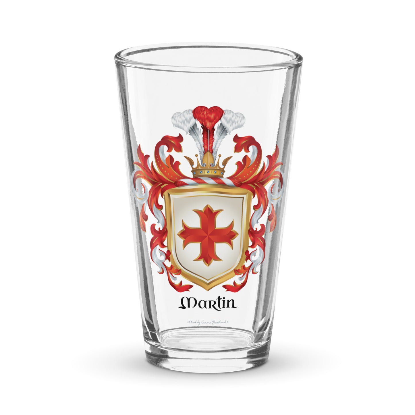 A pint glass with the Martin Family Crest featuring a red cross on a white shield 
