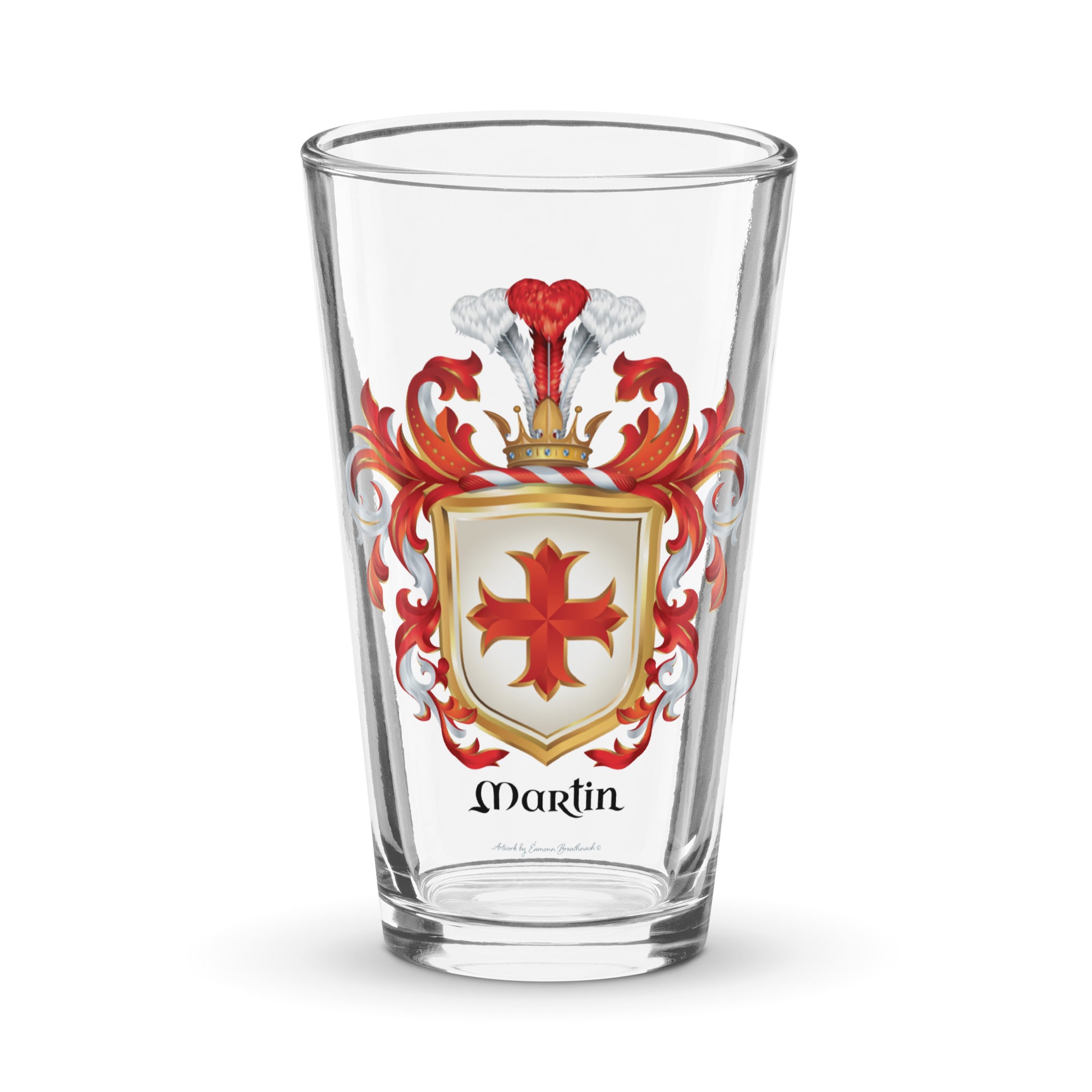 A pint glass with the Martin Family Crest featuring a red cross on a white shield 