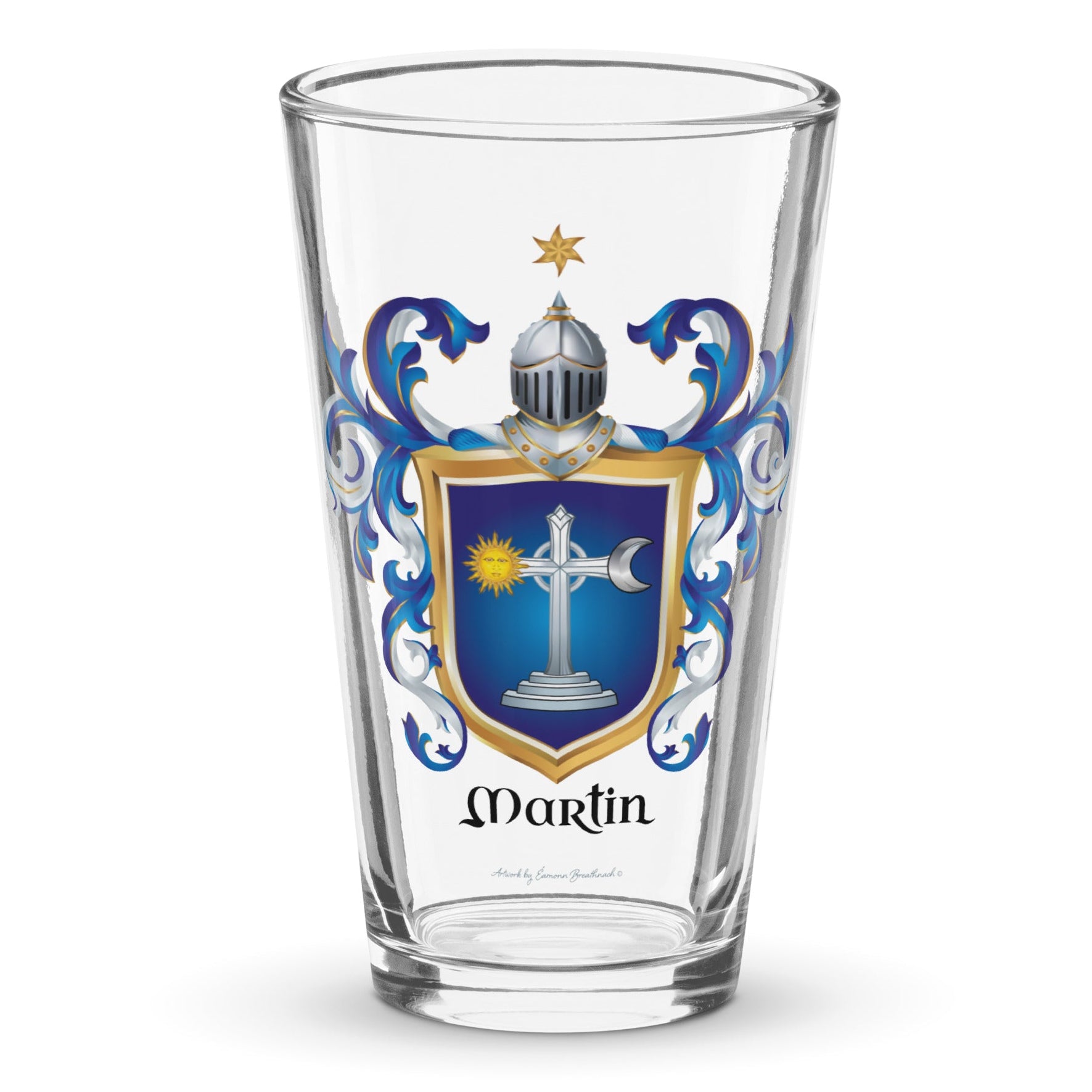 A pint glass on a white background with the Irish Martin Family Crest print on the glass