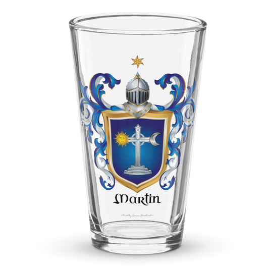 A pint glass on a white background with the Irish Martin Family Crest print on the glass