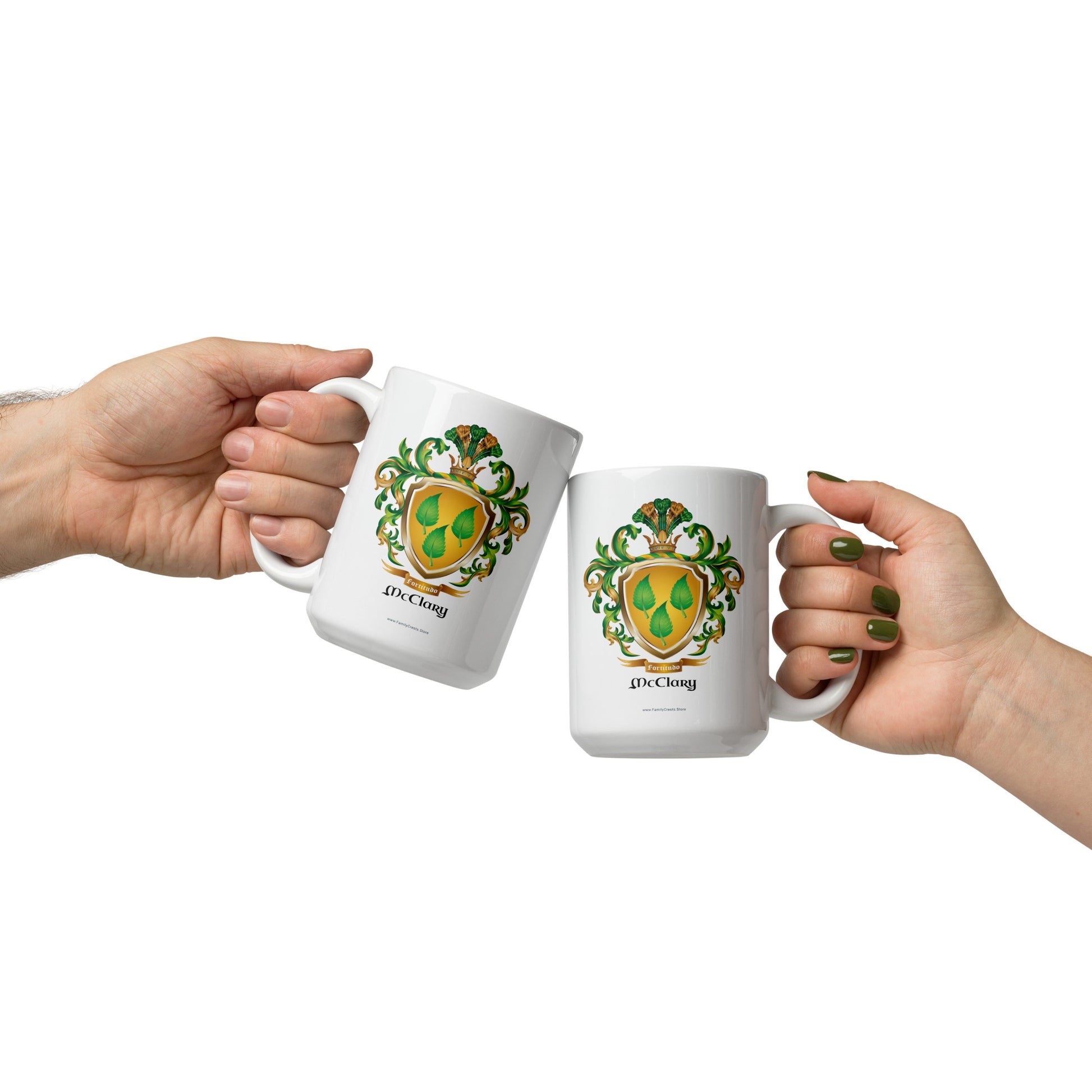 Two hands holding white McClary family name coat of arms mugs on a white background