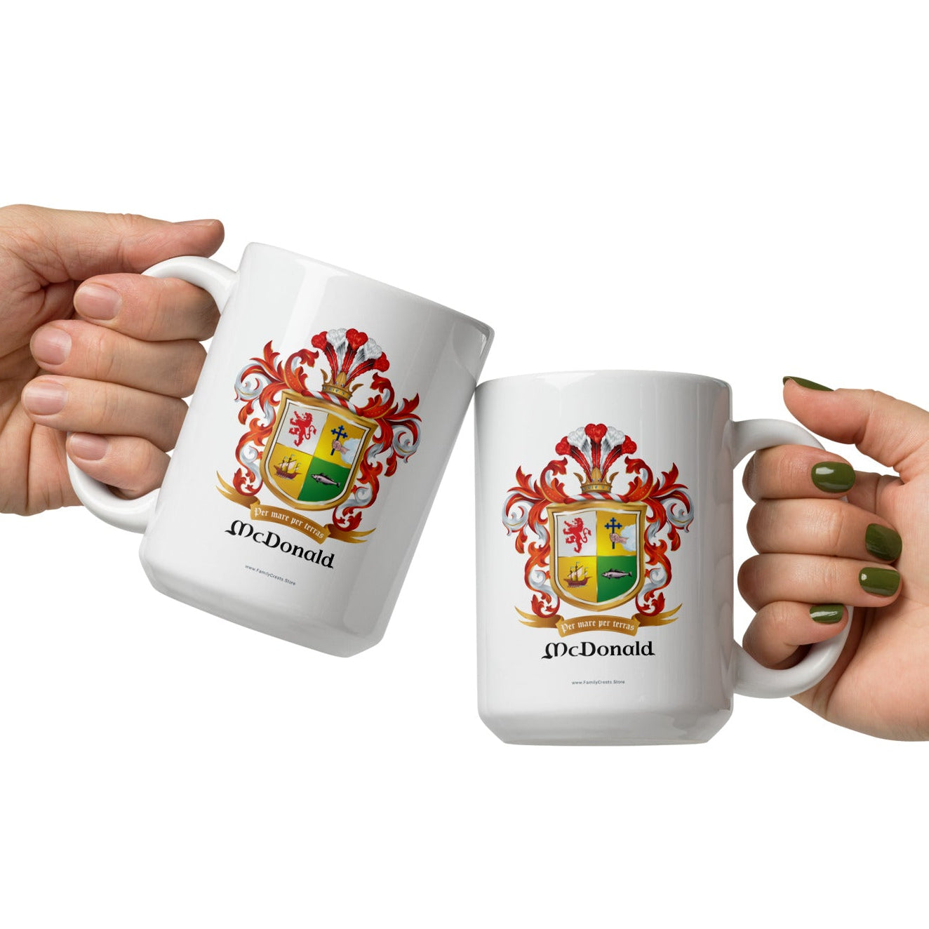 Two hands holding McDonald Family Crest on a white 15oz mugs against a white background