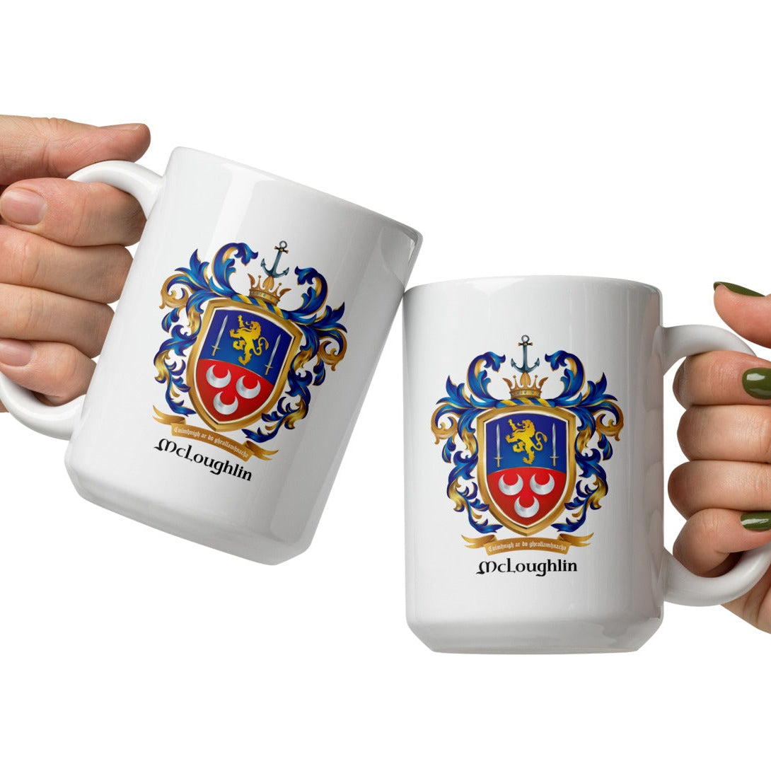 Two hands holding mugs with McLoughlin  crests ton a white background