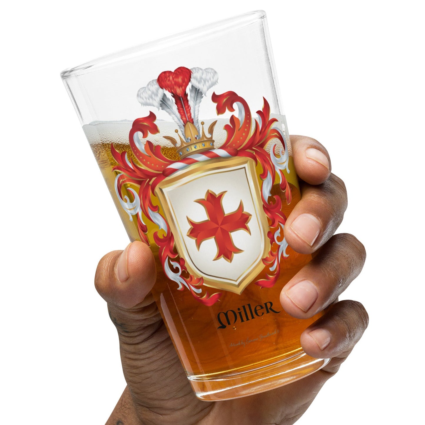 Hand holding a glass of beer with a Miller Family Crest on a white background