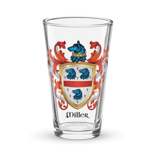 A clear pint size beer glass with the Miller Family Crest on a white background 