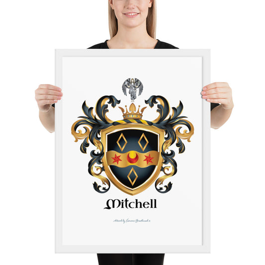 A woman standing in a white background, holding a white framed print of the Mitchell Family Crest featuring a black shield witha wavy gold ribbon with 2 red stars and a red cresent and 3 gold diamonds and an angel holding a dove above the shield on the crest.