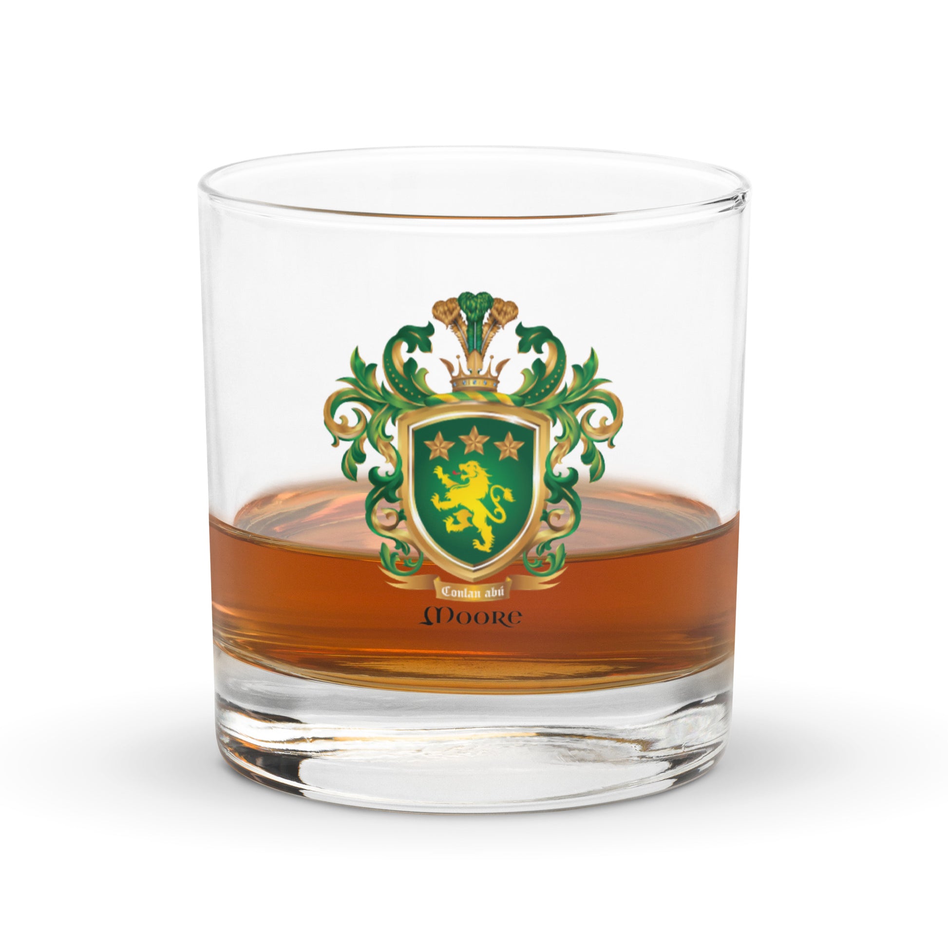 A rocks glass with the Moore Family Crest displayed on the front containing a measure of whiskey.